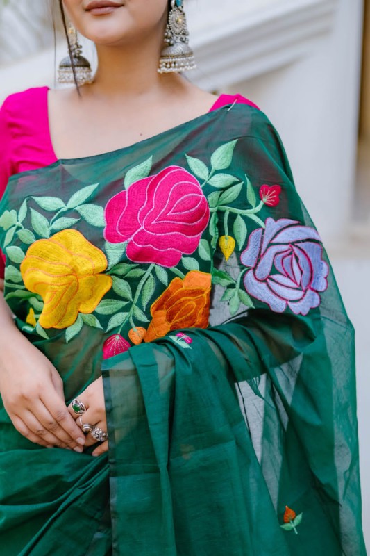 Half silk embroidered saree.