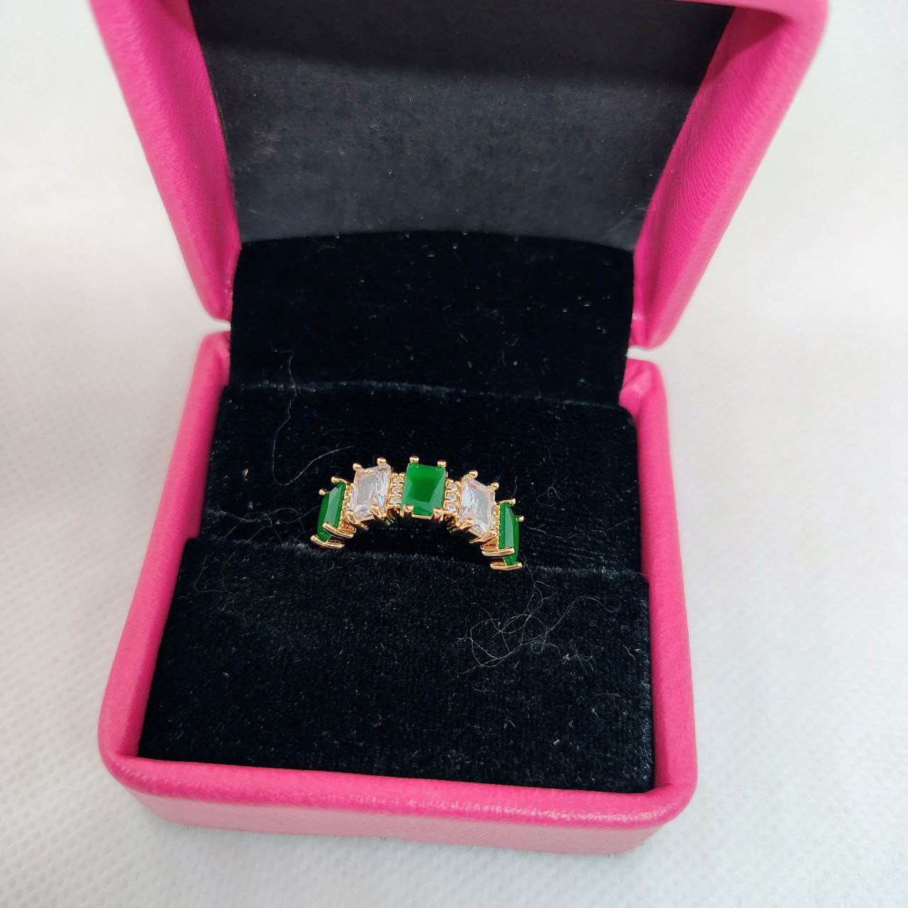 vibrant gold ring adorned with colorful gemstones,